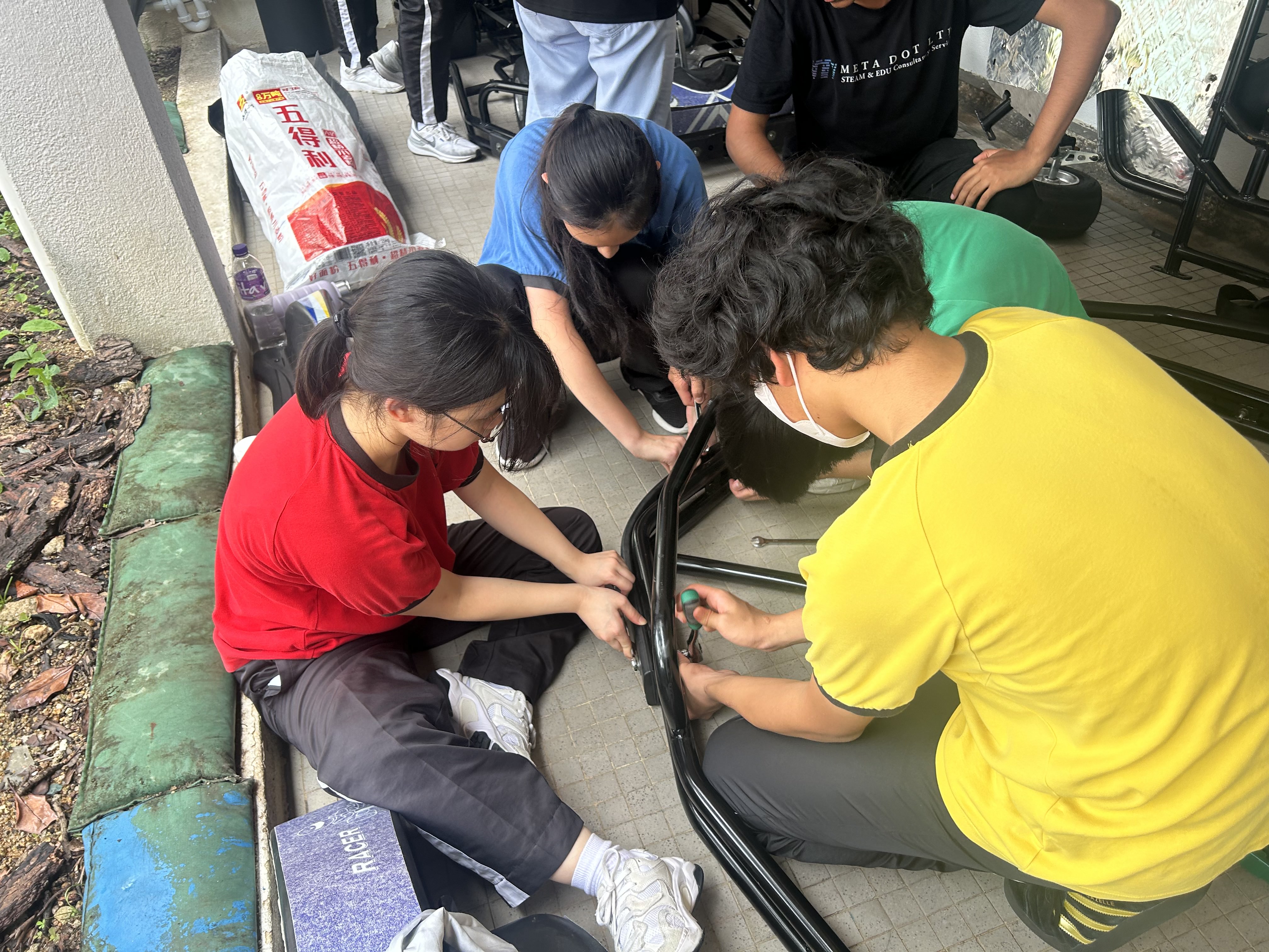 Students assembling go-karts